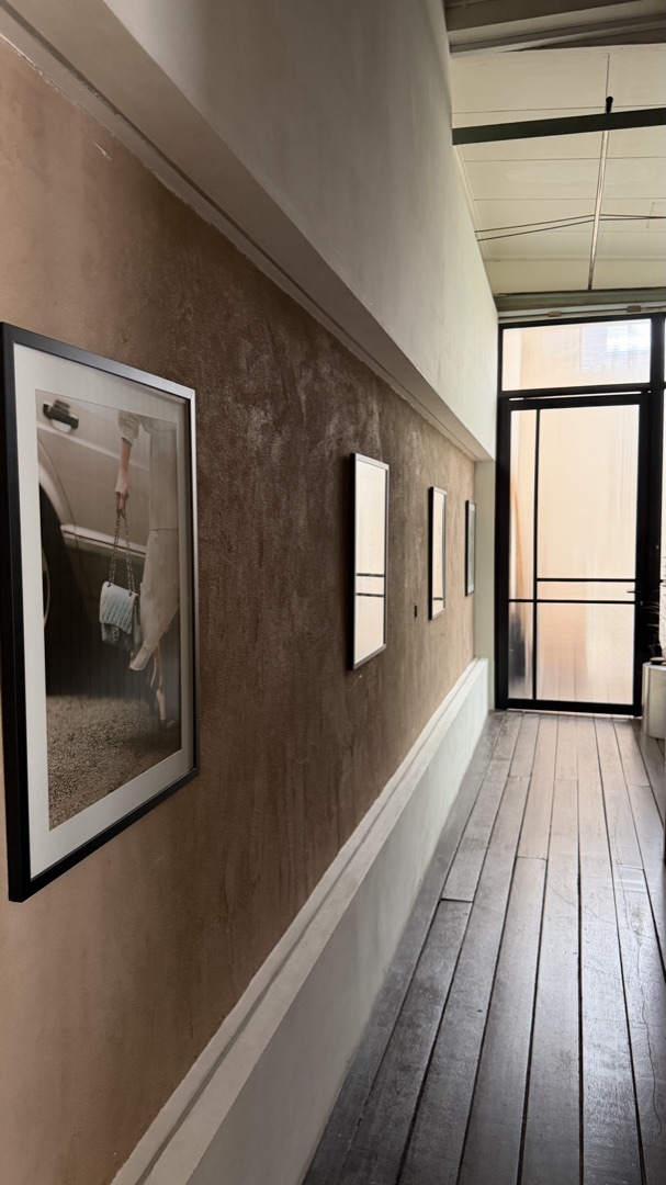 At the top, follow the gallery corridor to the glass door at the end.